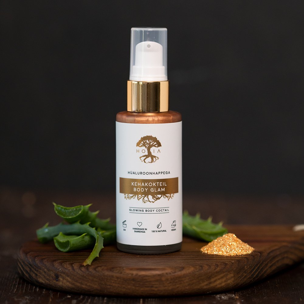 9. HOIA homespa Body Cocktail Body Glam bottle on wooden surface with aloe and shimmer, highlighting ingredients