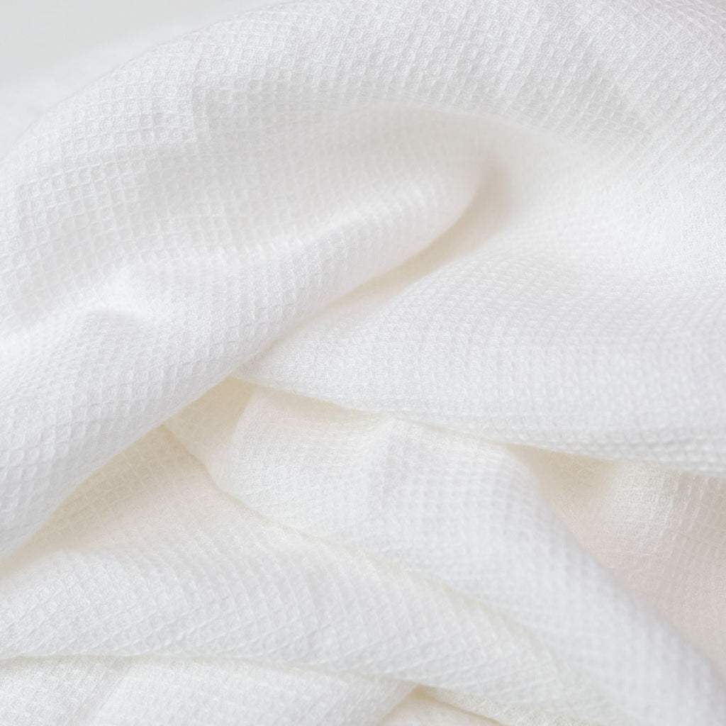 6. Close-up of white waffle linen fabric showing intricate weave and soft texture