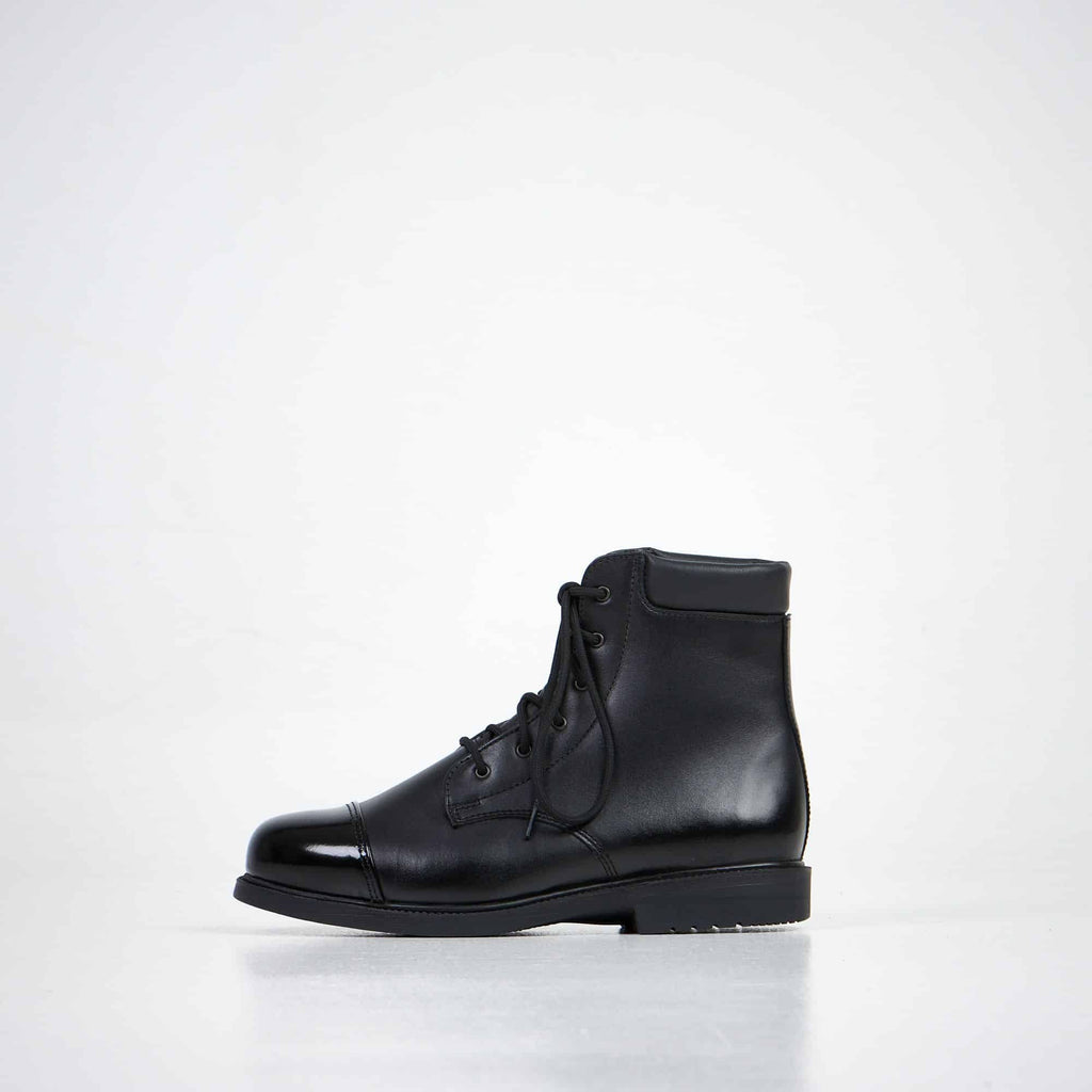 1. Unisex black leather ankle boots by Samelin, side view in studio setting