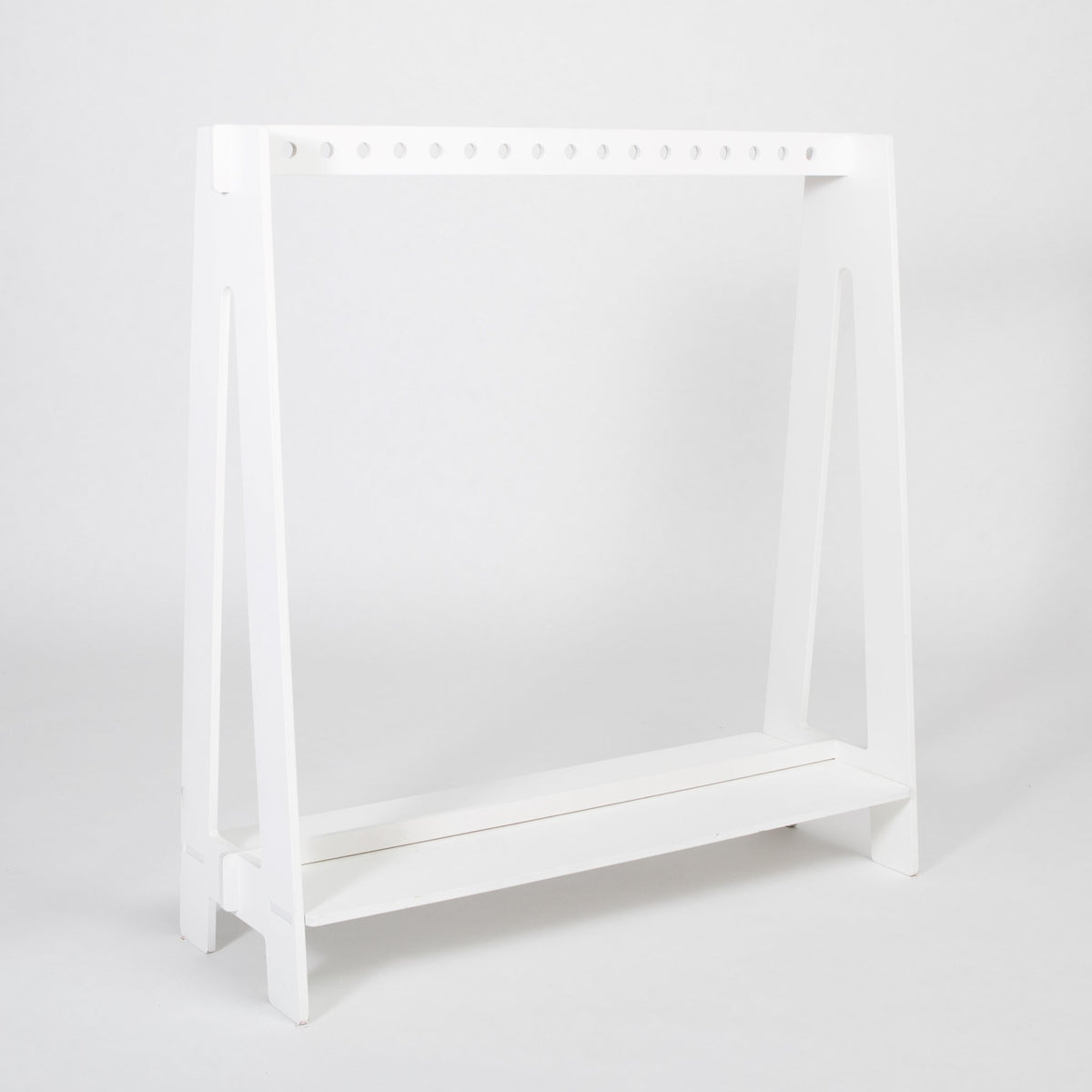 13. White toddler clothing rack with simple design on a white background