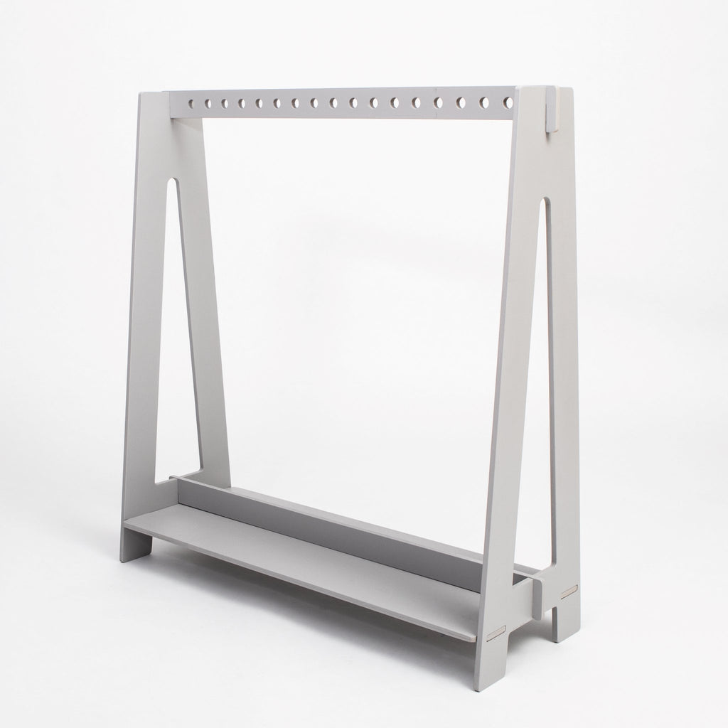 12. Grey toddler clothing rack with minimalist design on a white background