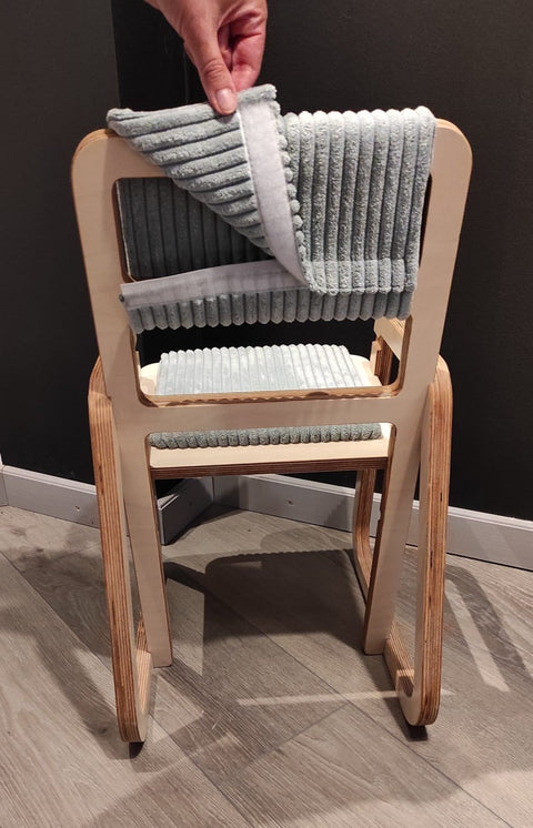 5. Close-up of removable mint green back padding on children's chair