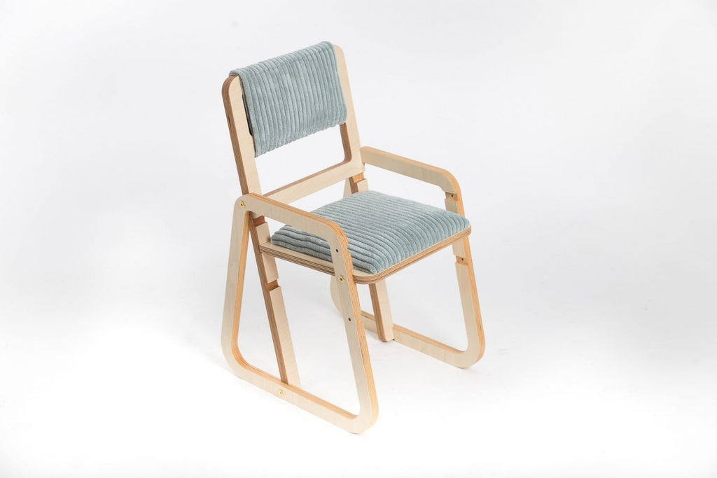 1. Adjustable children's chair in mint green velvet with natural wood frame on white background