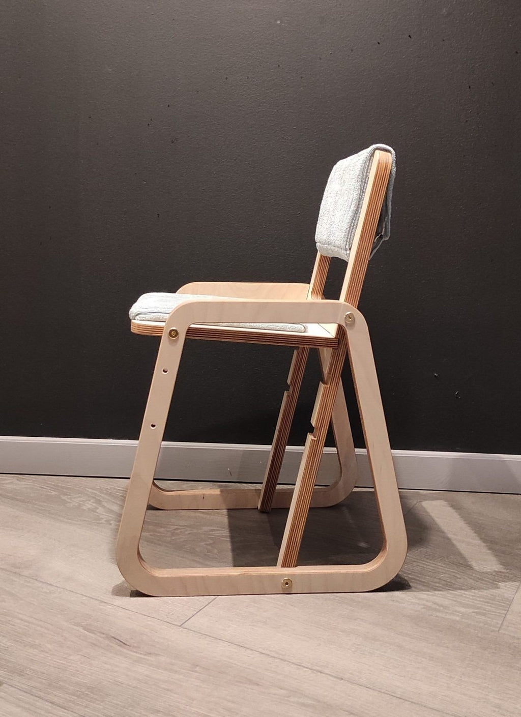 6. Side profile of mint green children's chair with natural wood frame