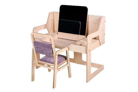2. Adjustable children's chair in cannon pink paired with a wooden desk, shown from back in studio setting