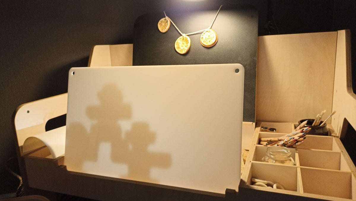 6. LUULA acrylic whiteboard on desk with shadow play under warm lighting