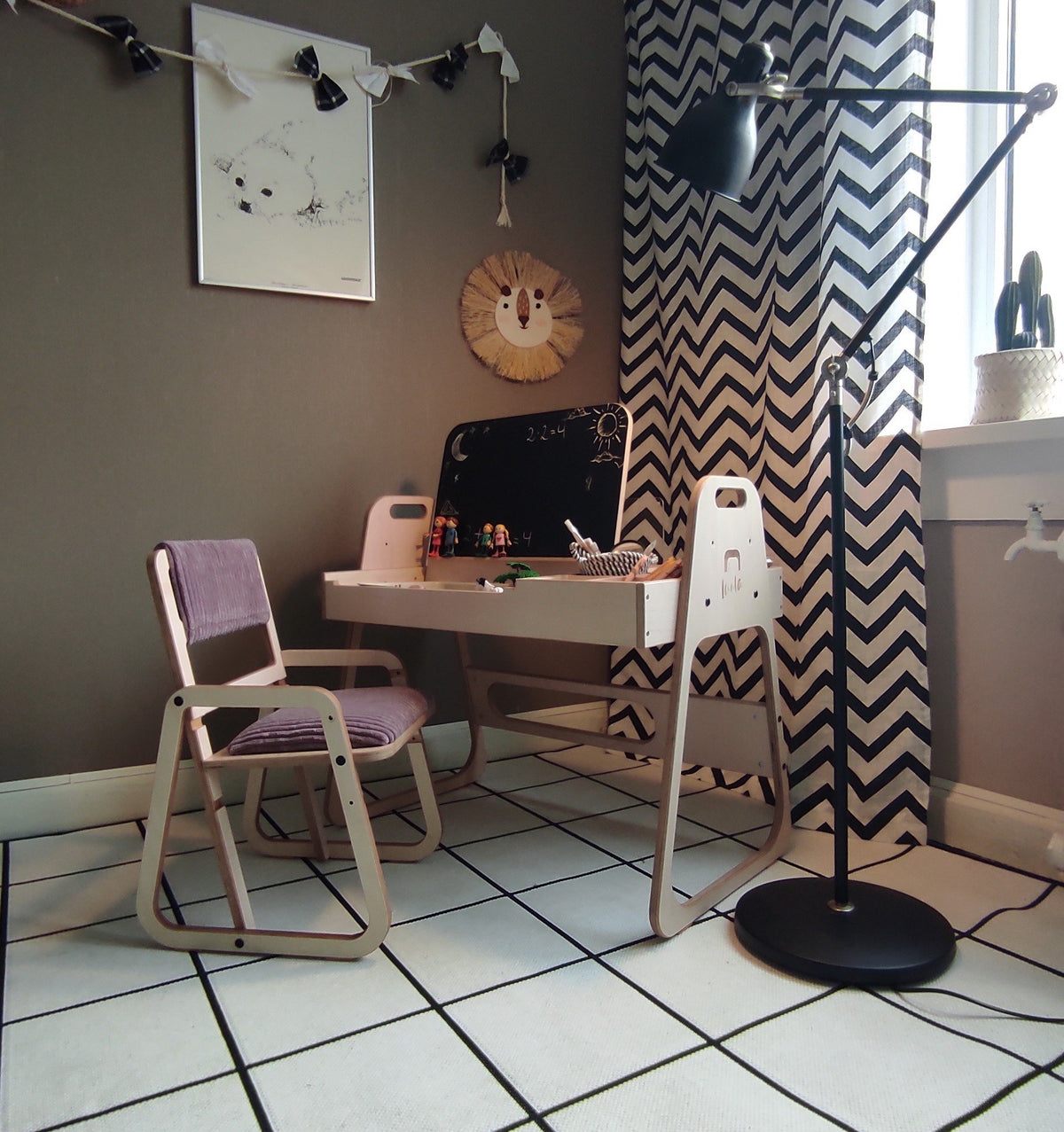 3. Children's study area with cannon pink table and chair set, featuring a lamp and chevron curtains