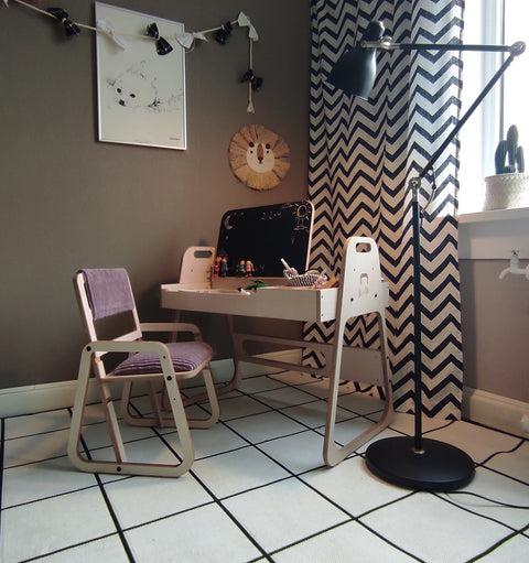 3. Children's study area with cannon pink table and chair set, featuring a lamp and chevron curtains