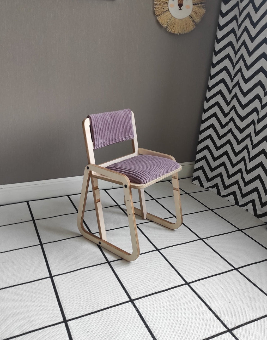 21. Luula Julle chair in cannon pink without armrests, emphasizing adjustable design