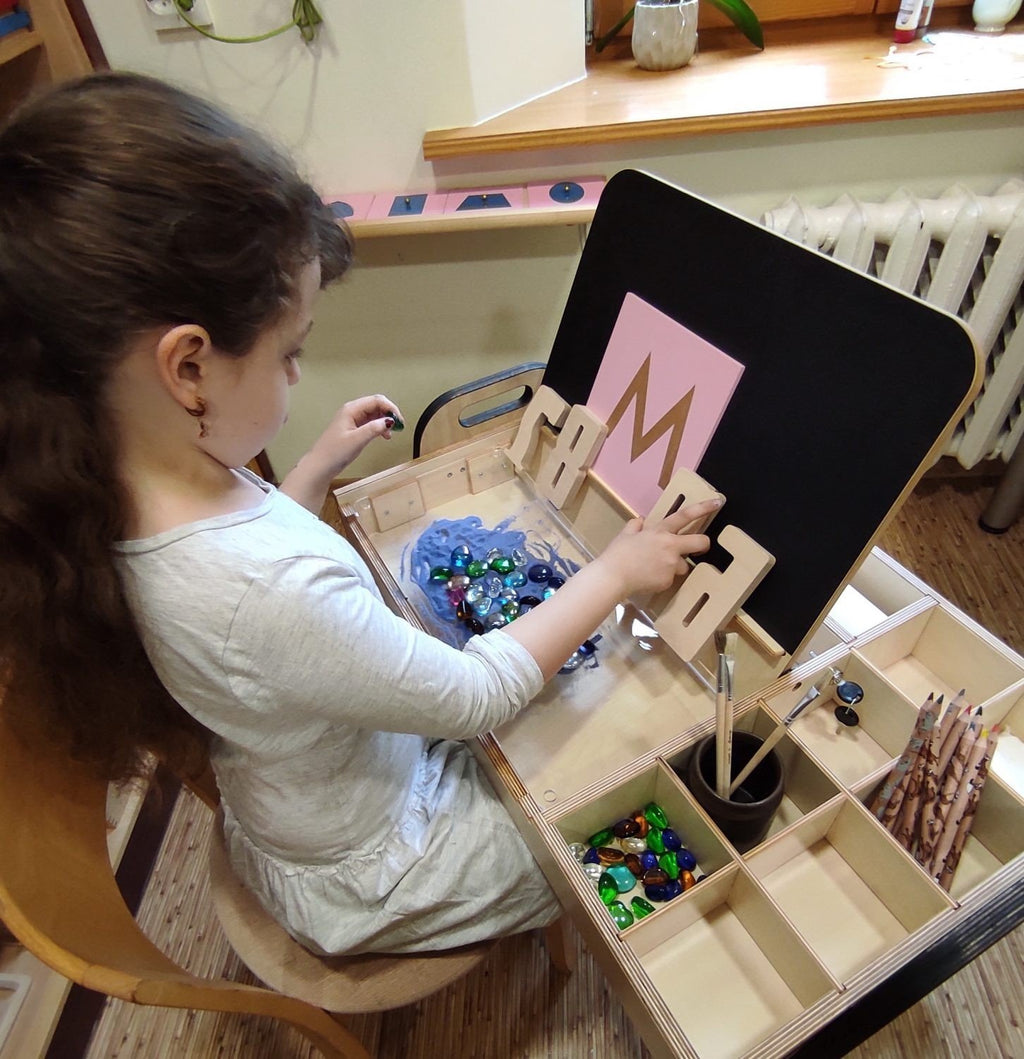 1. Girl engaging with Montessori table and educational materials