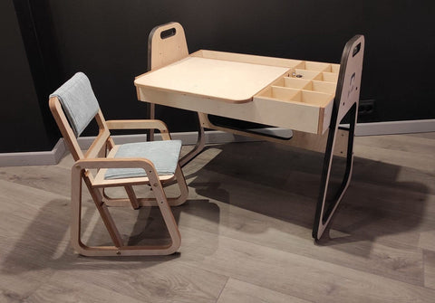 1. Children's table and chair set in a cozy room with wooden flooring