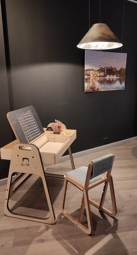 1. Montessori table and chair set under a warm light in a room