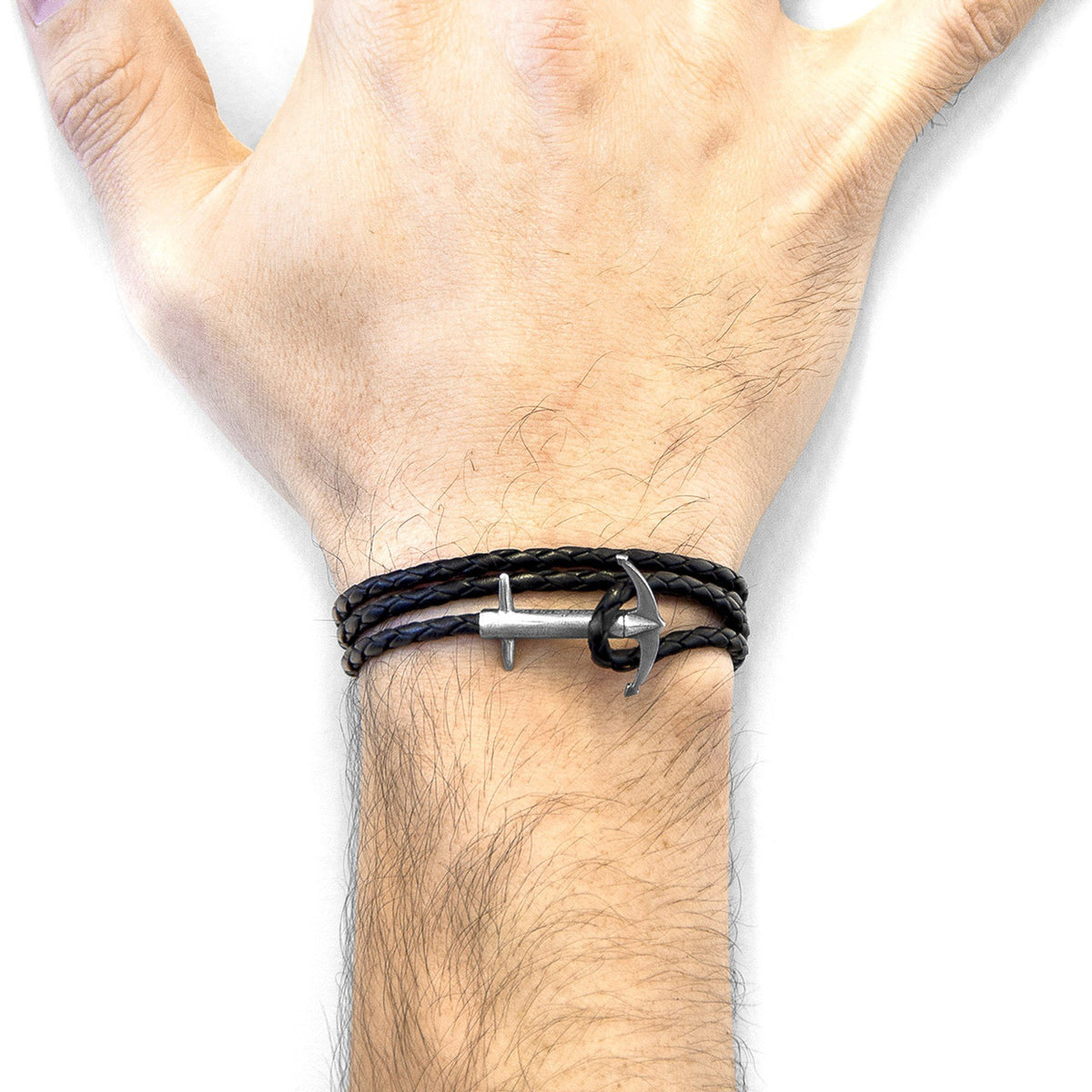 2. Men's Coal Black Admiral Anchor Silver and Braided Leather Bracelet by ANCHOR & CREW on wrist