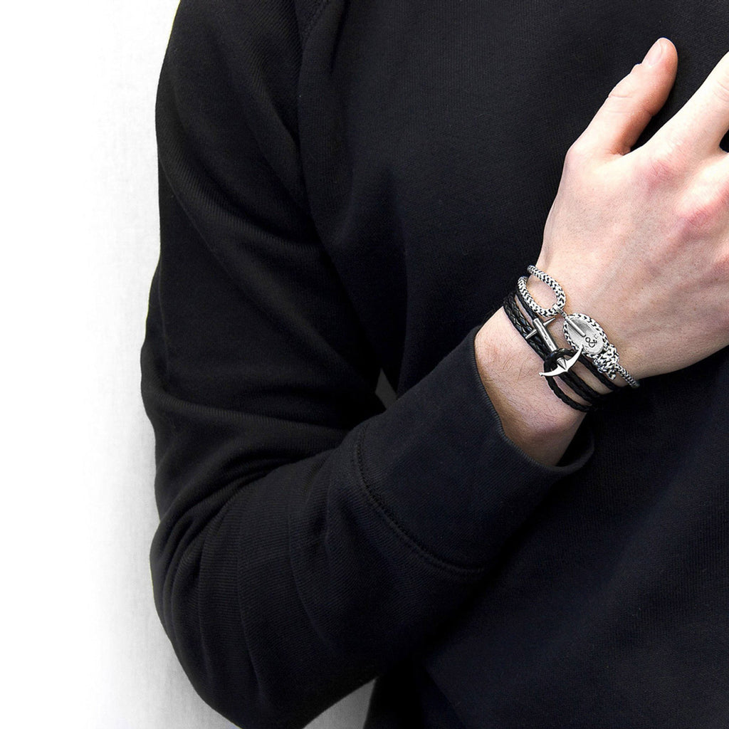 1. Men's Coal Black Admiral Anchor Silver and Braided Leather Bracelet by ANCHOR & CREW worn with black sweater