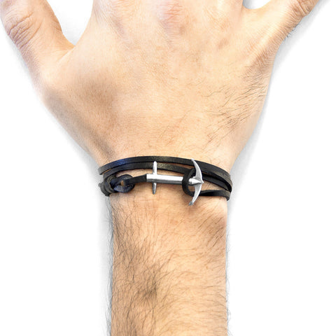 3. Men's wrist wearing Coal Black Admiral Anchor Silver and Flat Leather Bracelet by ANCHOR & CREW, showing adjustable fit