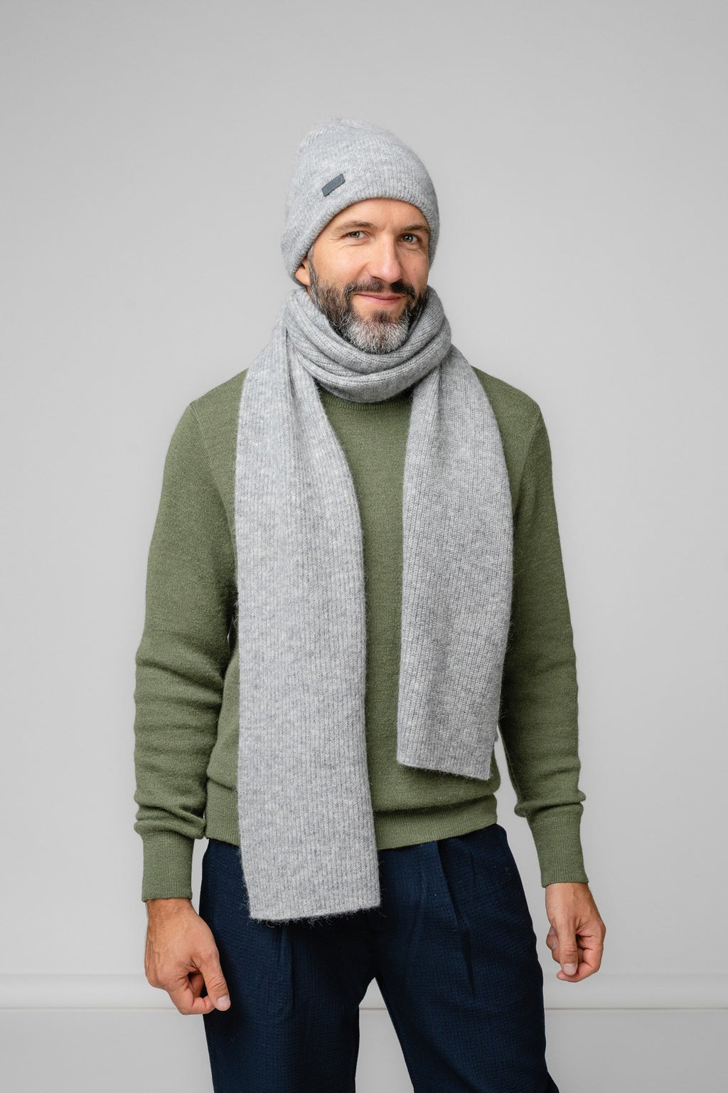 11. Men's silver Alpaka Fisherman's Rib scarf and hat set in studio setting