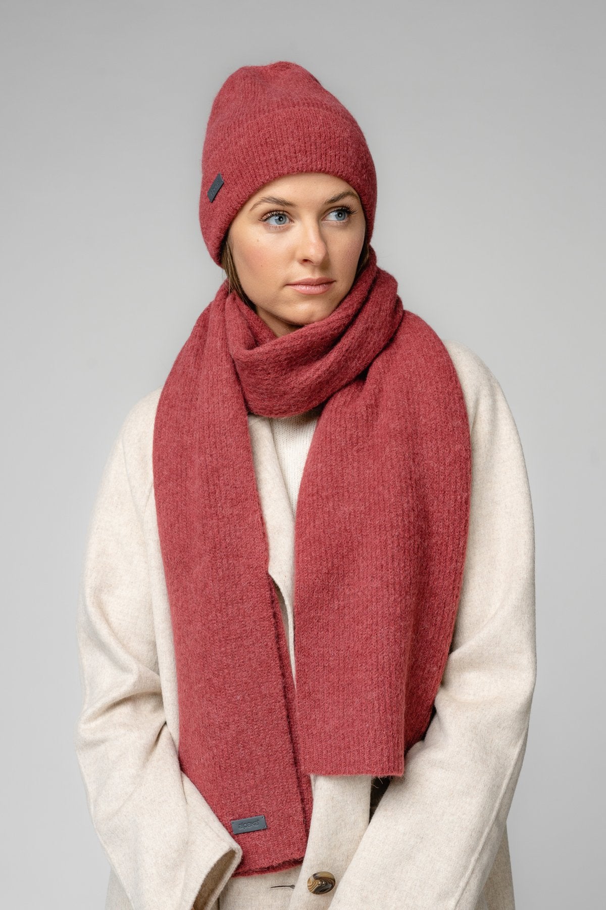 18. Women's amber Alpaka Fisherman's Rib scarf and hat shown in side view