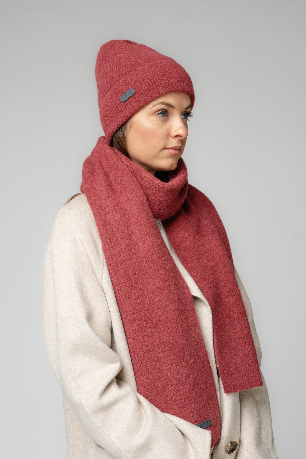 17. Women's amber Alpaka Fisherman's Rib scarf and hat set in studio setting