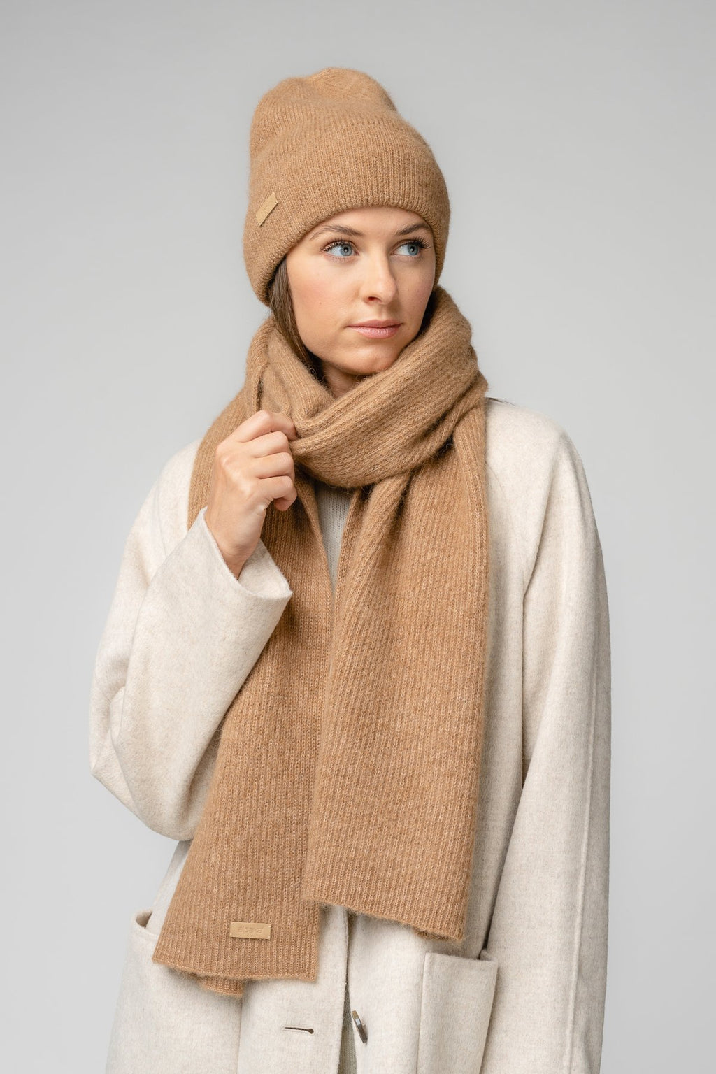24. Women's camel Alpaka Fisherman's Rib scarf and hat shown in side view