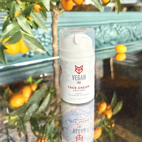 3. Vegan Fox Anti-Age Face Cream 50ml with amber and yarrow, displayed outdoors with citrus
