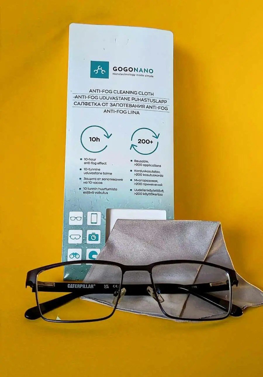 2. GoGoNano anti-fog cleaning cloth with packaging and eyeglasses on yellow background
