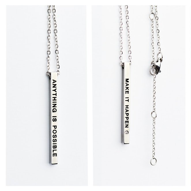 2. Studio image of Olla necklace with double-sided pendant featuring 'Make it Happen' and 'Anything is Possible' inscriptions in silver