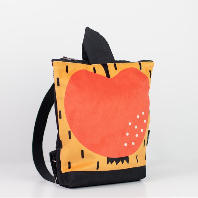 5. Side view of Muni apple backpack for kids, showing adjustable straps and durable material