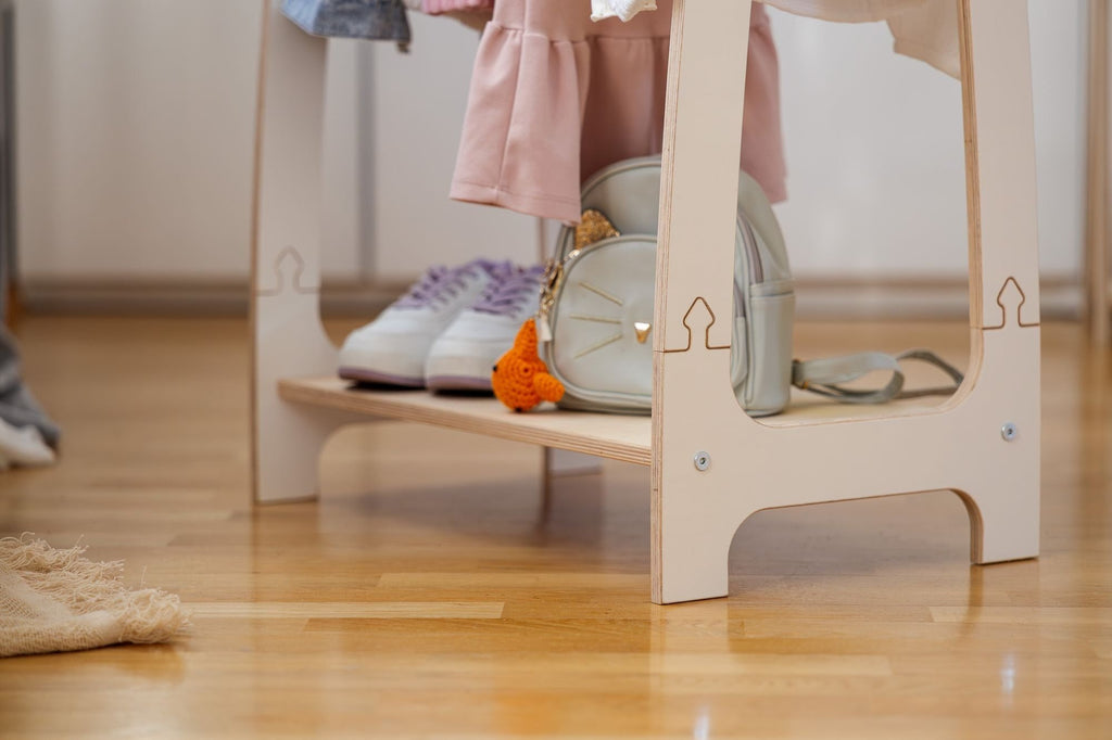 3. Close-up of bottom shelf on MeowBaby white arched clothing rack with shoes and bag