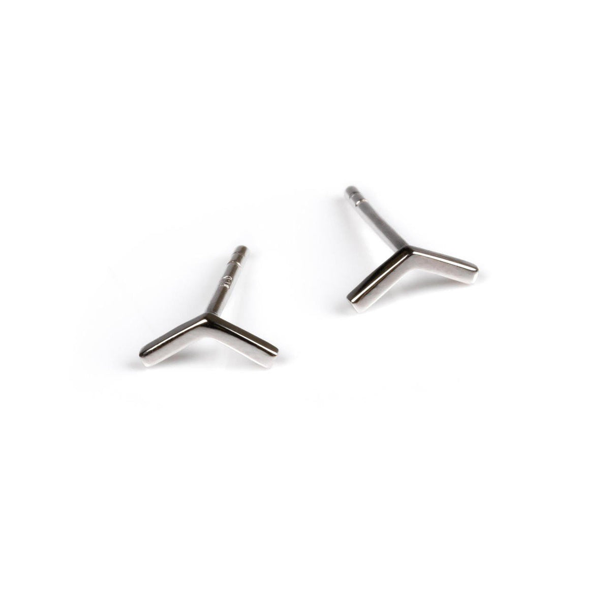 1. Pair of small silver arrow earrings made from 925 silver on a white background