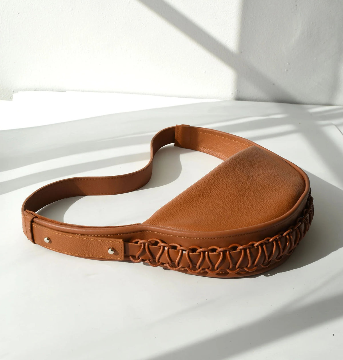 6. Studio shot of Gerda Retter Design Leather Bag Ateena in caramel brown, highlighting texture