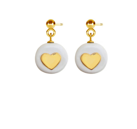 2. SCULP Pure Love Earrings featuring white ceramic pendants and 24K gold-over sterling silver hearts, studio shot