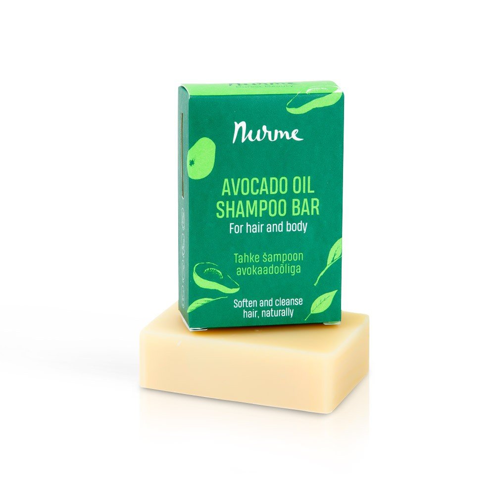2. Nurme avocado oil shampoo bar in green packaging on top of beige soap bar against white background