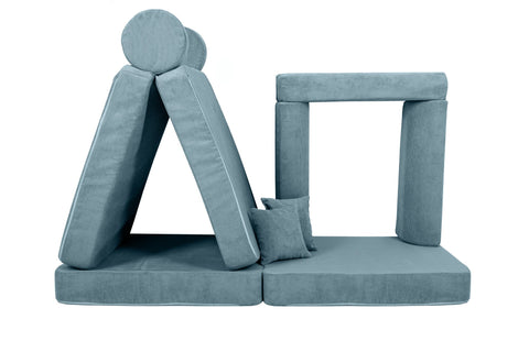 4. Turquoise corduroy children's sofa arranged in a tent-like structure with cylindrical cushions on a black background