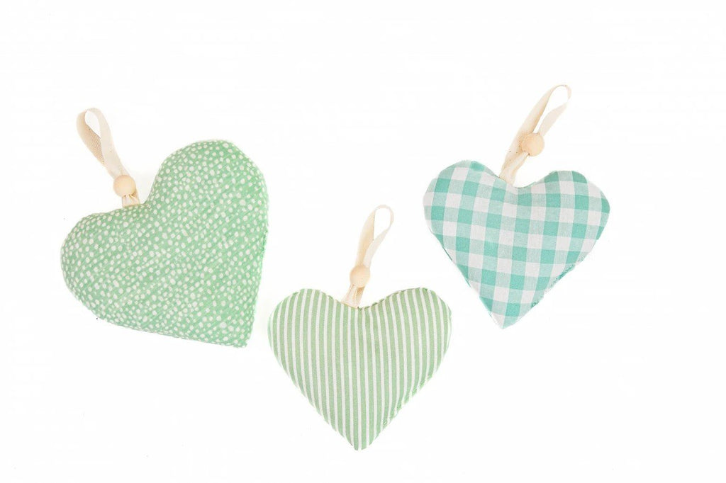 6. Three mint green heart-shaped hanging toys for baby activity mat