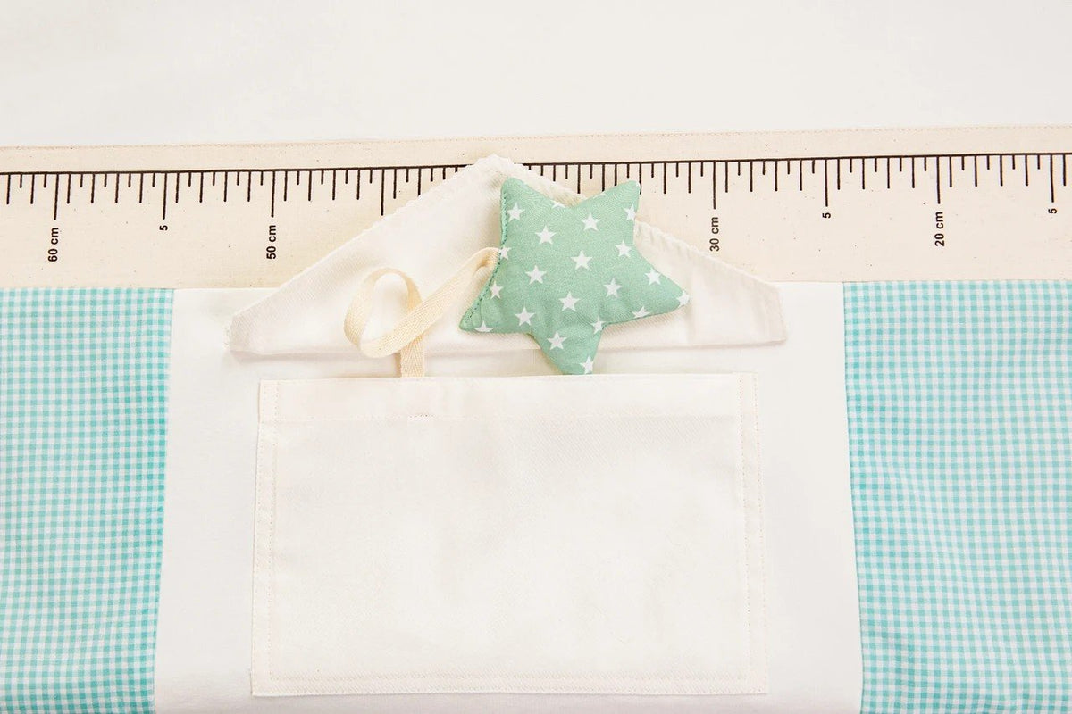 3. Close-up of star-shaped toy and pocket detail on baby activity mat