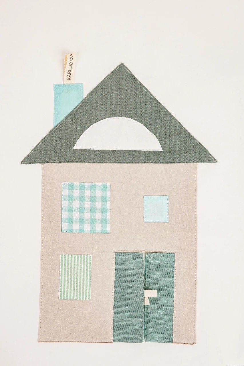3. Close-up of house design with patchwork details on baby activity mat