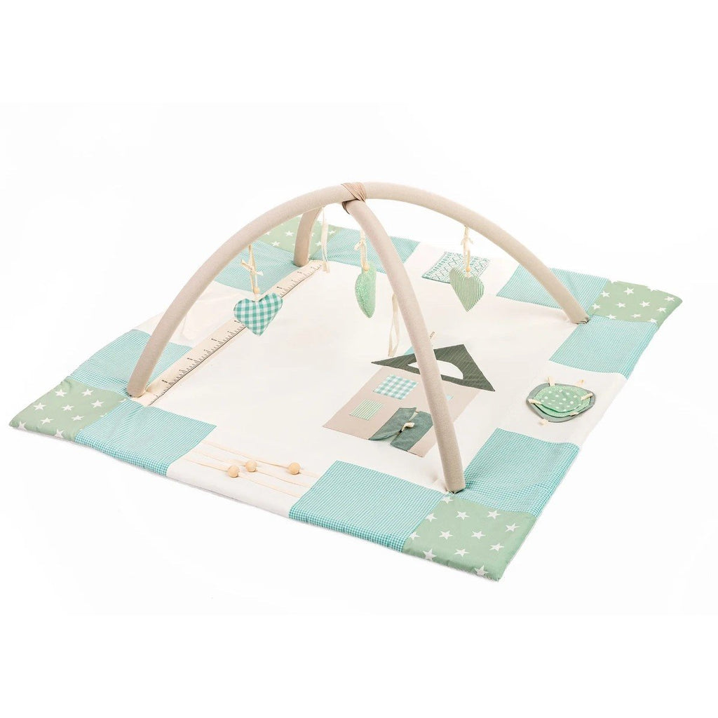 1. Mint green baby activity mat with removable arches and hanging toys in a Nordic color palette