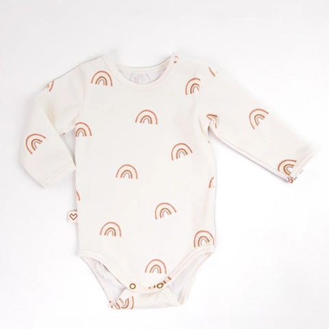 2. Studio shot of Karloova baby bodysuit with rainbow print on white background, showcasing long sleeves and snap-button design