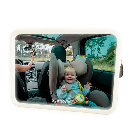 1. Baby in car seat visible through Ezimoov LED car mirror with driver adjusting rearview, outdoor setting