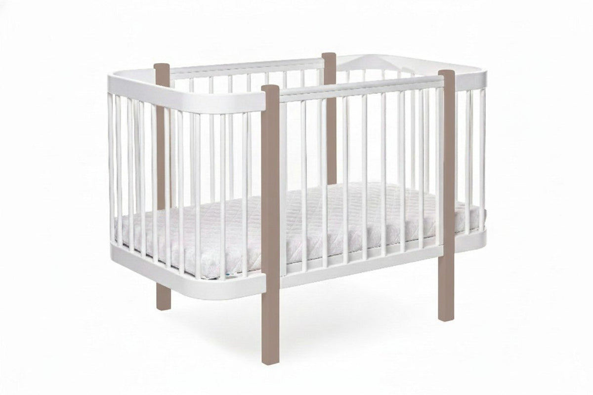 2. Studio shot of KOTTO ELIN baby crib in cappuccino and white, showcasing slatted design and mattress