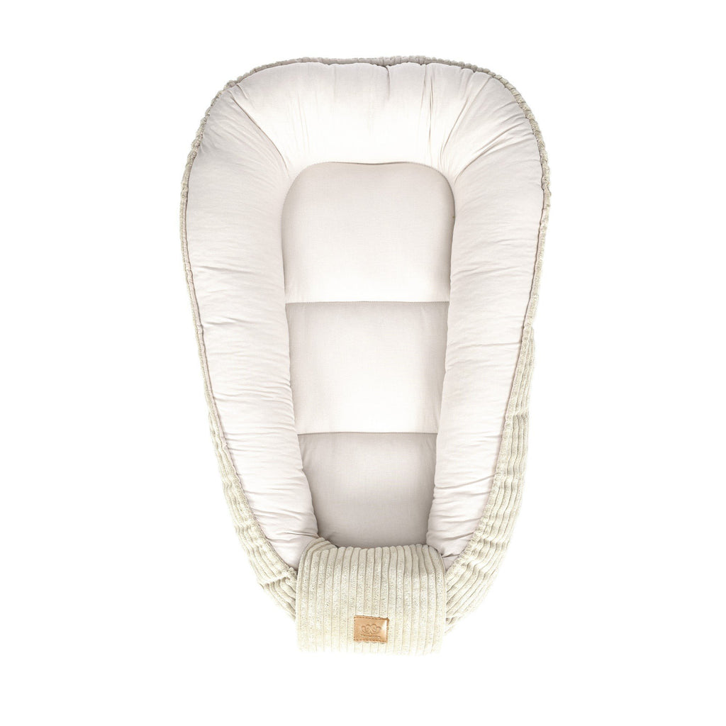 5. Ecru baby nest with cushioned interior, ribbed sides, and MeowBaby logo, shown from top view