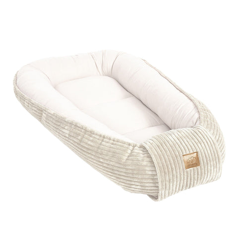 1. Ecru baby nest with cushioned sides and ribbed texture, featuring MeowBaby logo, shown in studio setting