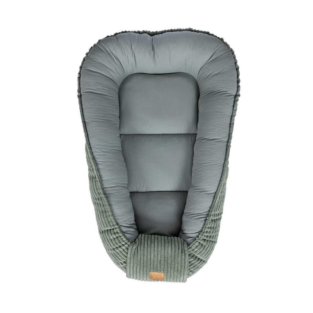 2. Olive green baby nest with soft interior and ribbed exterior, shown from above