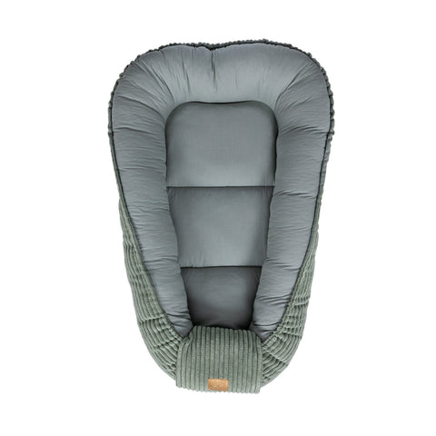 2. Olive green baby nest with soft interior and ribbed exterior, shown from above