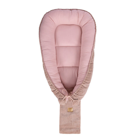 4. Powder pink baby nest with adjustable ties and ribbed fabric, shown from top view