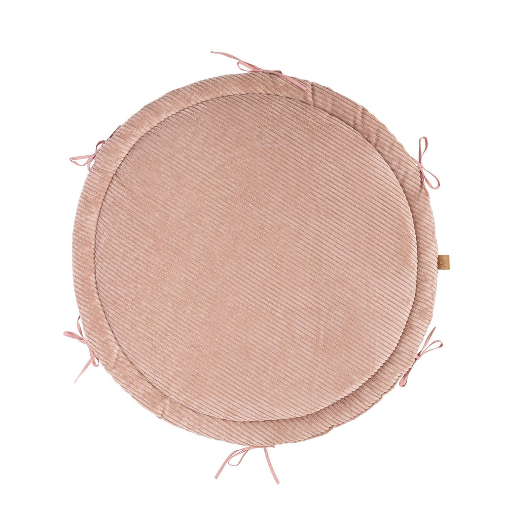 2. Powder pink ribbed corduroy play mat with tied edges, shown from top view