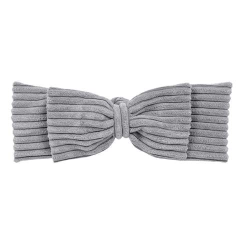 3. Close-up of grey corduroy braided bumper with bow detail, detachable for crib or playpen use