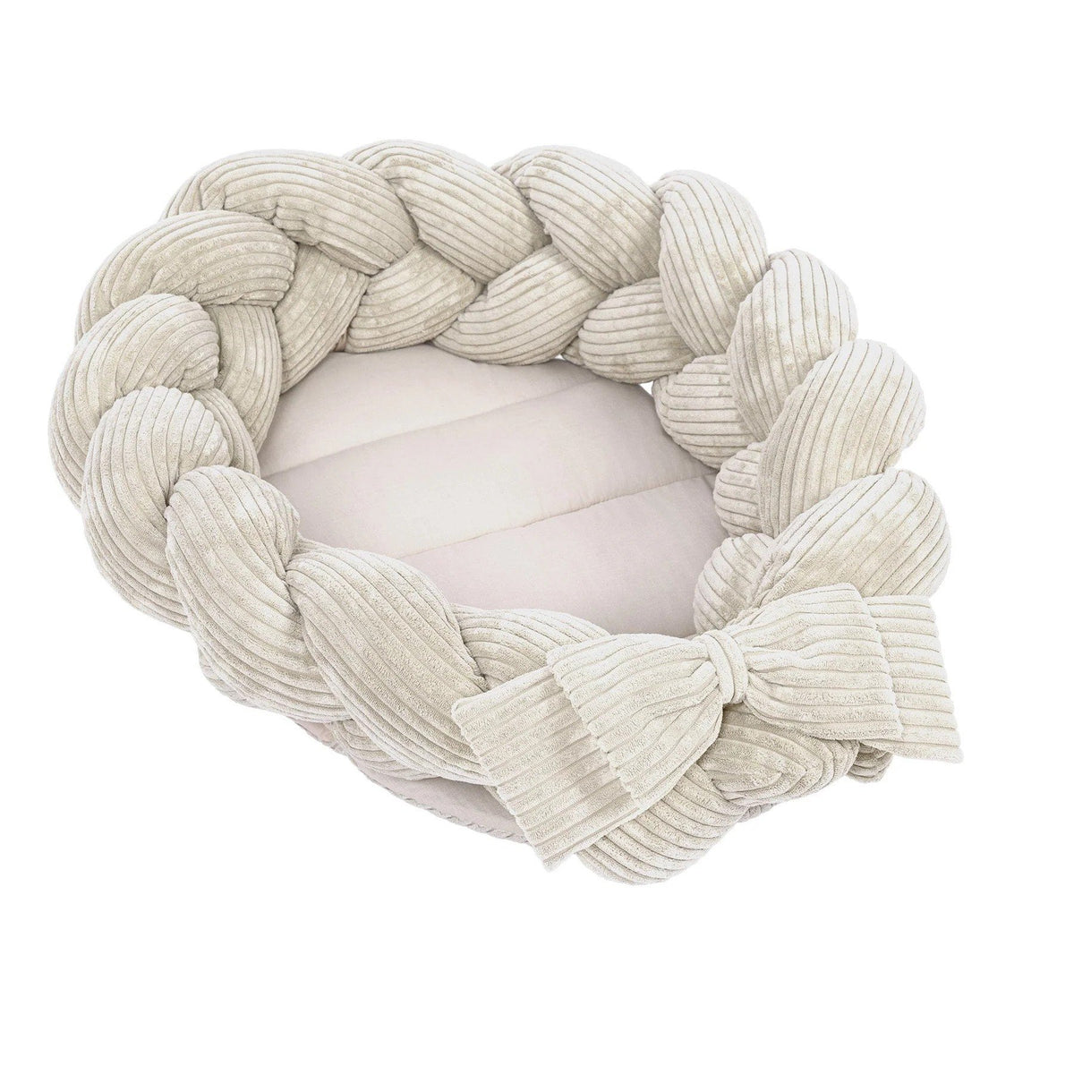 1. Vanilla baby nest with braided bumper in soft corduroy, featuring a large bow, ideal for newborns