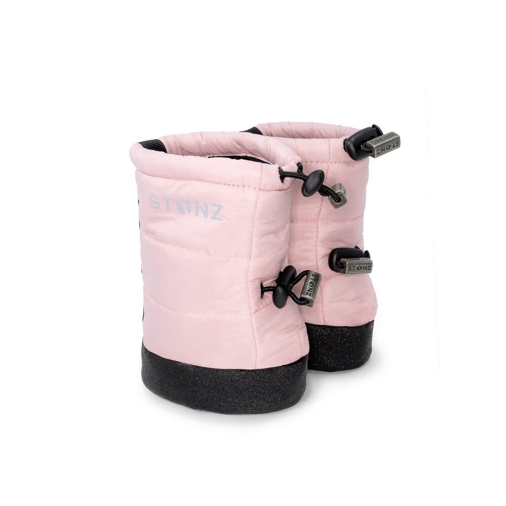 2. Pink Stonz Puffer Booties with black soles and elastic straps in studio setting