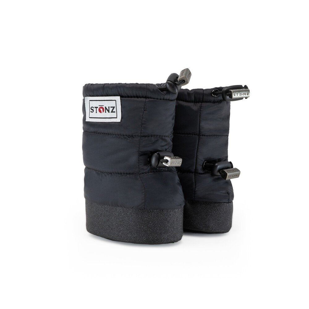 2. Black Stonz Puffer Booties with elastic straps and logo patch in studio setting